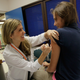 University of Miami pediatrician Judith L. Schaechter, M.D. (L) gives an HPV vaccination to a 13-year-old girl in her office at the Miller School of Medicine on September 21, 2011 in Miami, Florida. Photo via Getty Images.